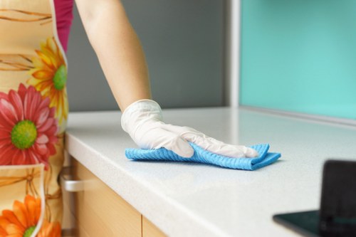 Airbnb cleaner preparing a Balham short-let living room for guest arrival
