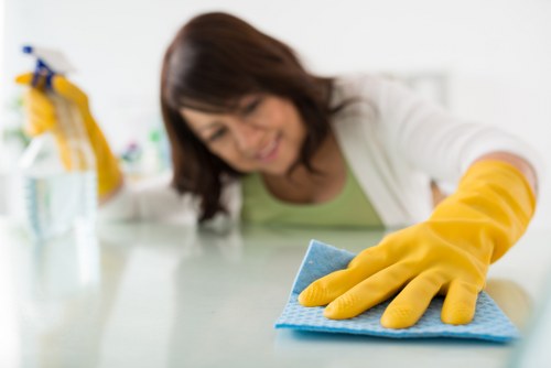 Professional Balham cleaners working on a tidy living space